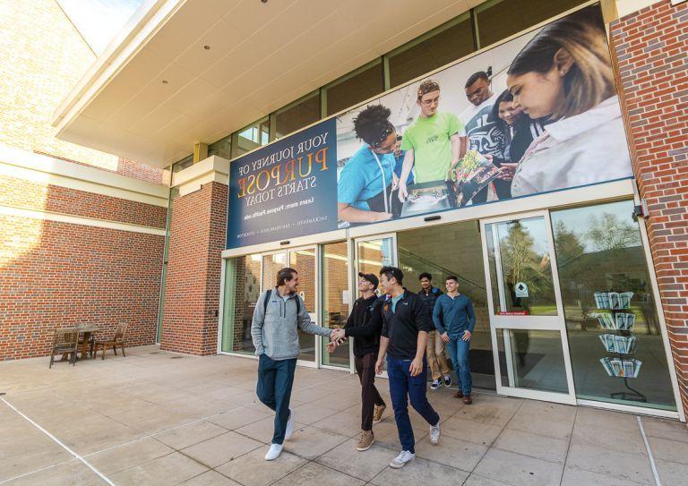 students walk outside the DUC